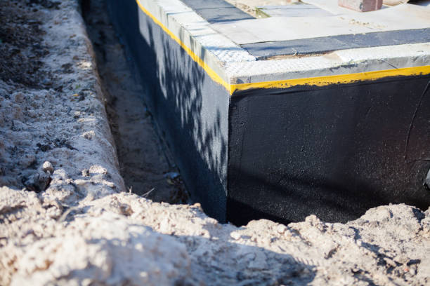 Professional Basement Waterproofing technician working in Tucker, GA